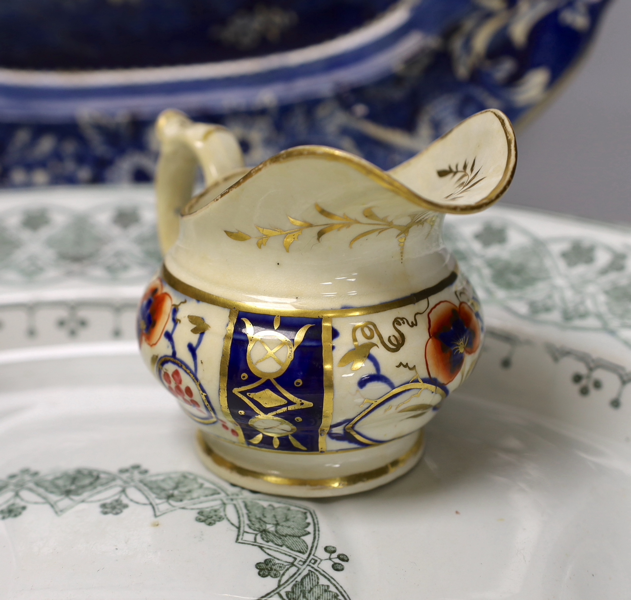 A Davenport meat dish, another and two jugs, largest 53cm